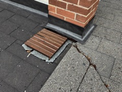 Roof photograph: flashing where the chimney meets the shingles